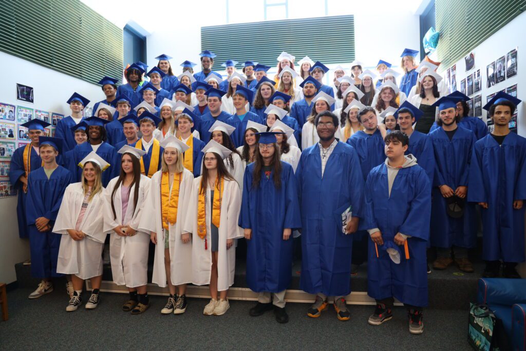 class of 2024 in caps & gowns