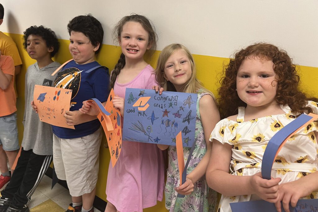 students holding signs