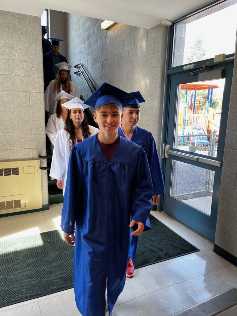 seniors walk through CES hallway