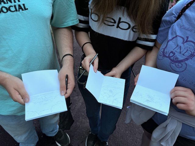 students looking at sketches