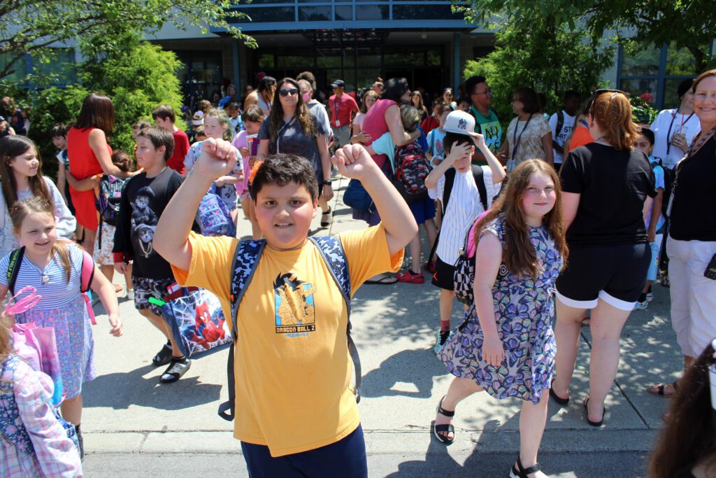 students exiting elementary school
