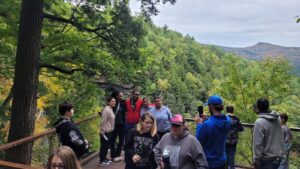 students near waterfall