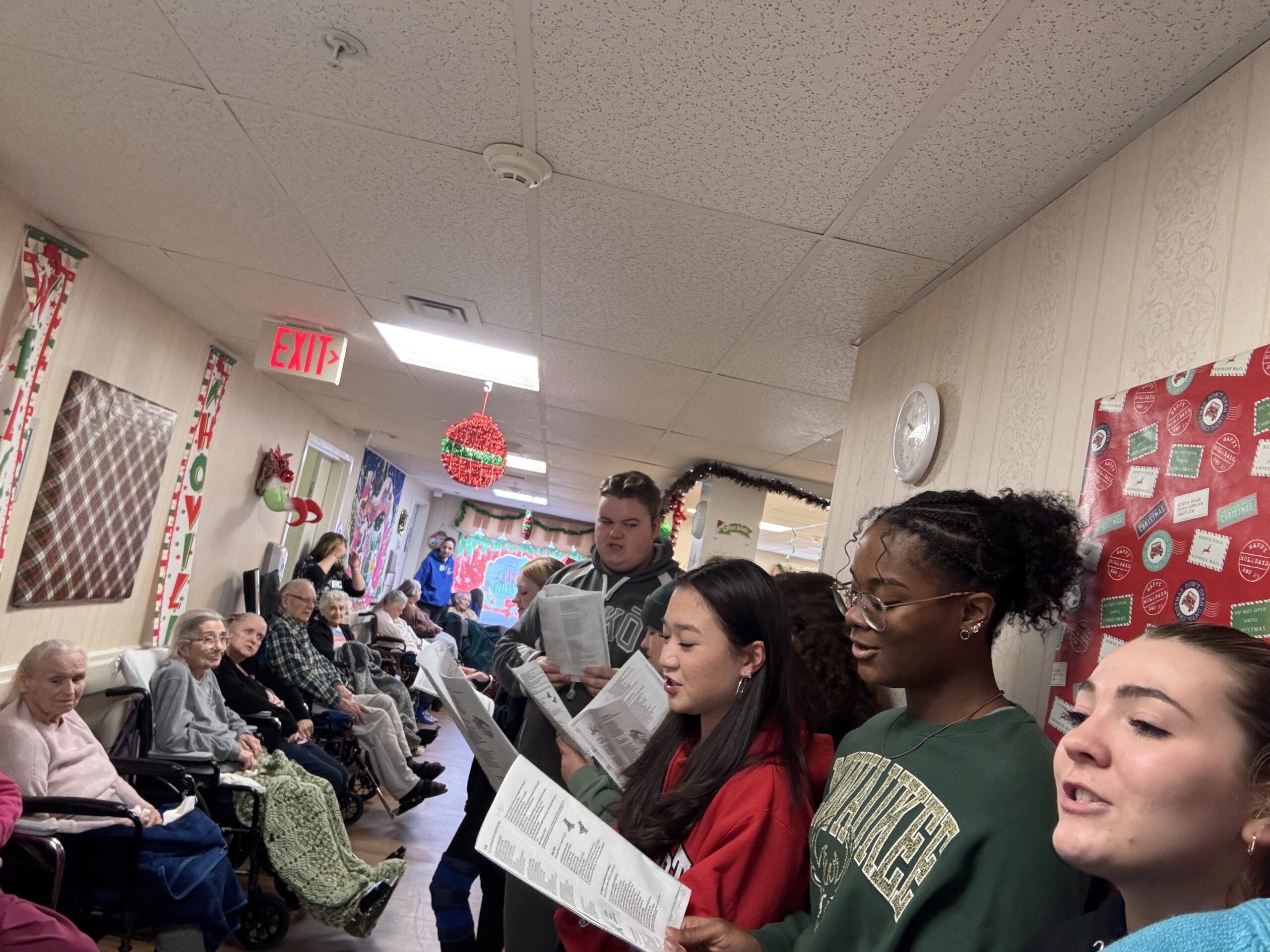 students signing in senior center