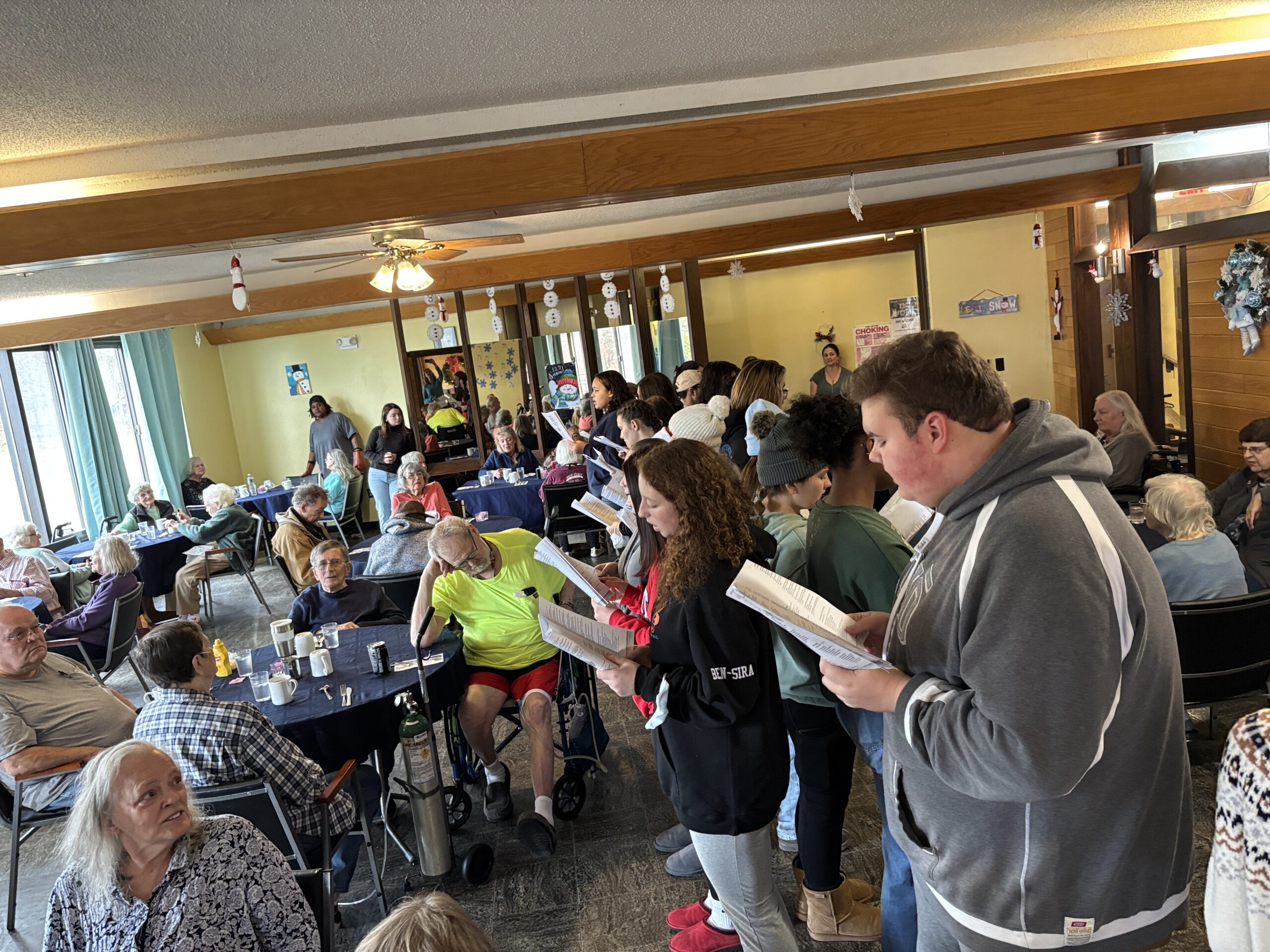 students signing in senior center