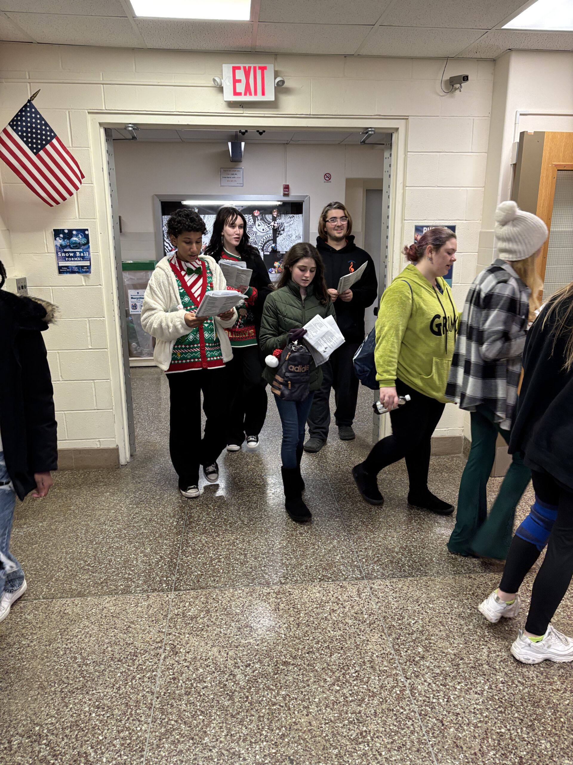 students walking through school hallway