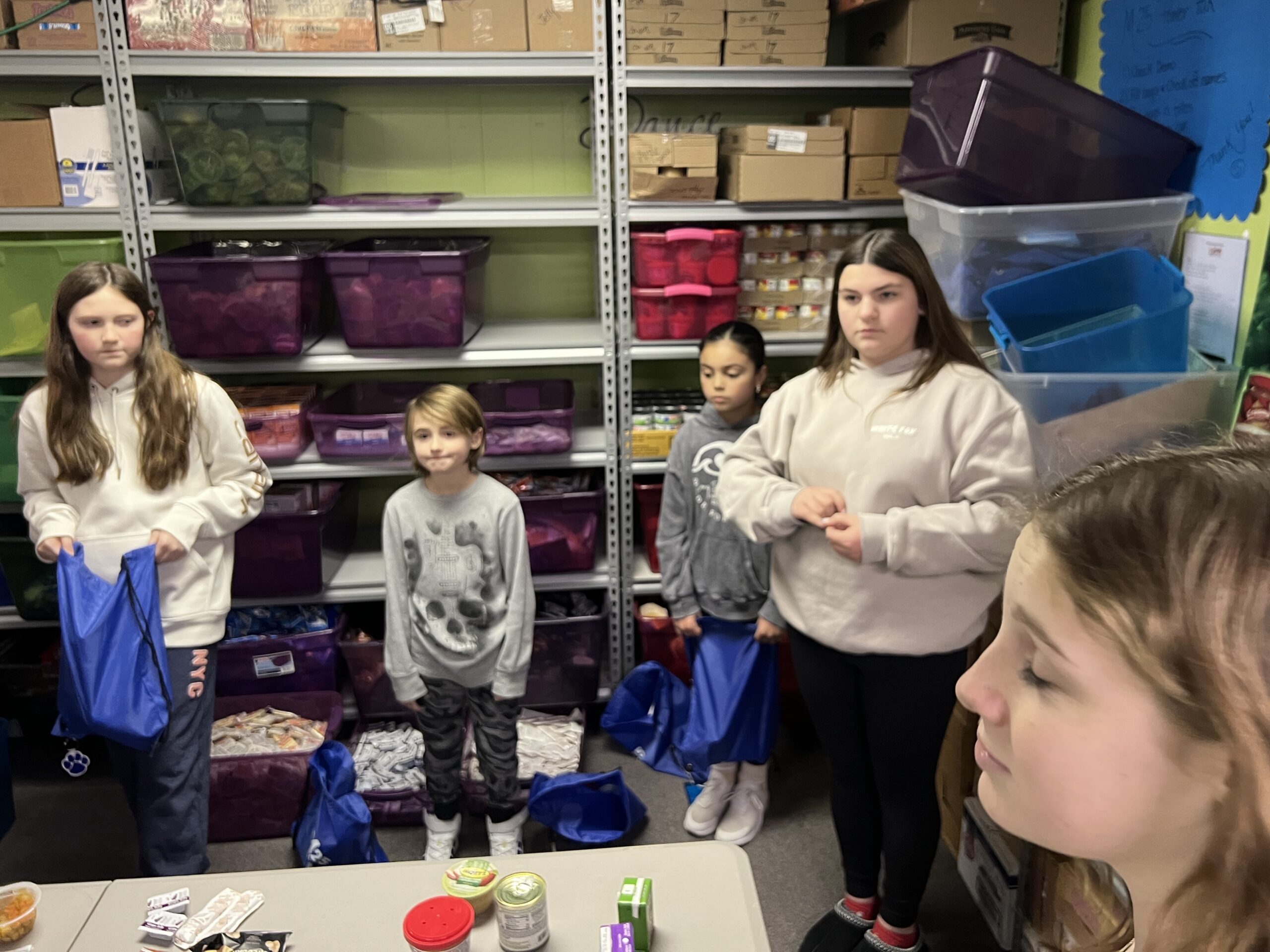 students helping at food pantry