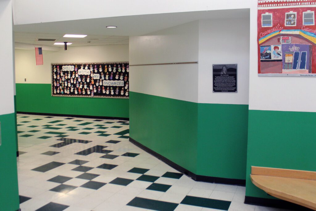 green wing in CES with plaque at enterance.