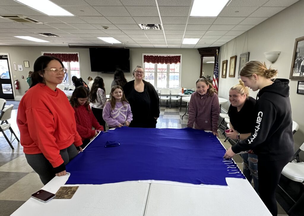 students making blanket