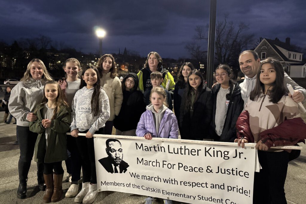 students holding Martin Luther King Jr. banner