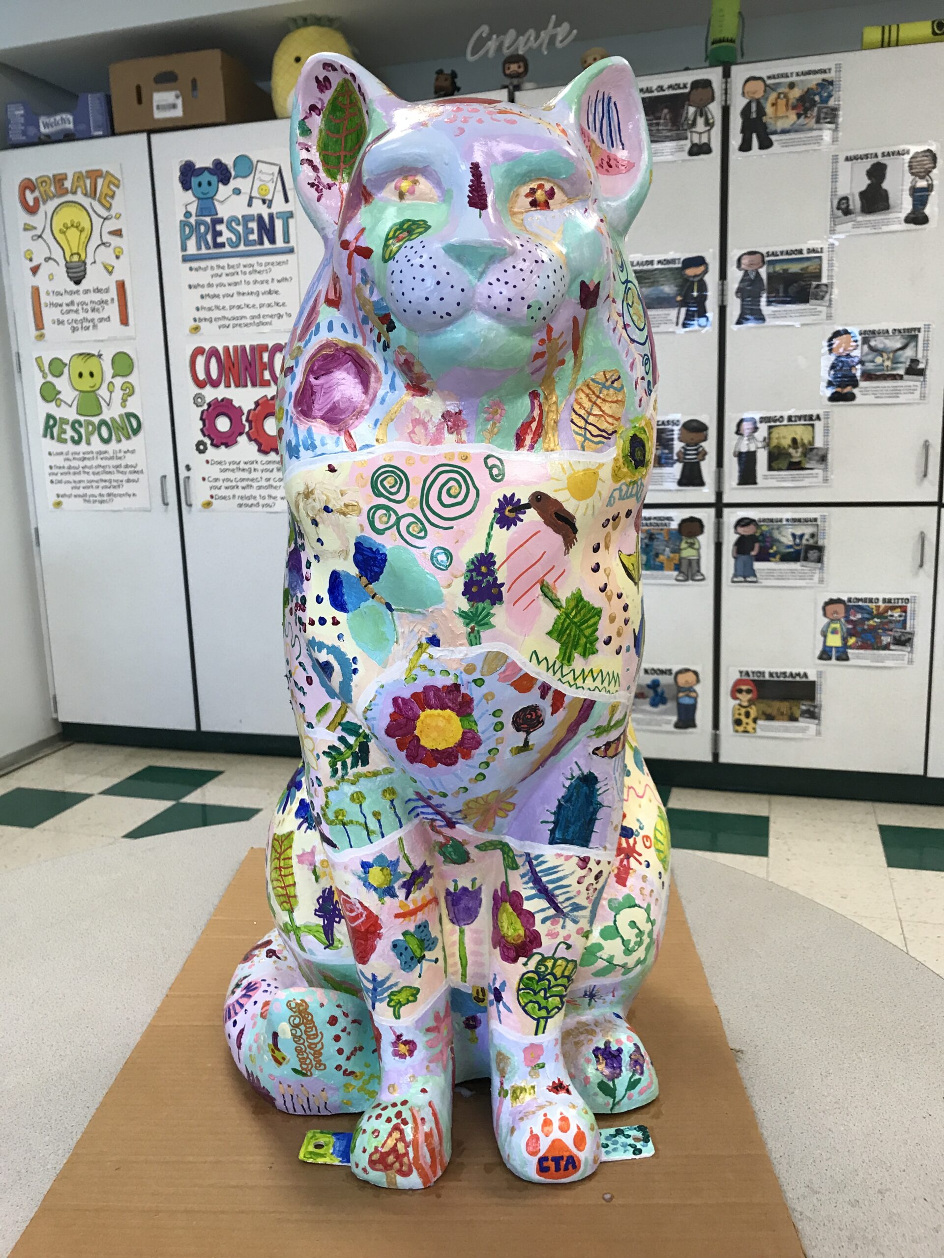 Cat sculpture painted with flowers