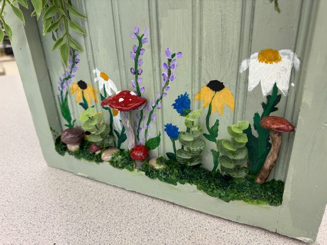 flowers and other plants on wooden box