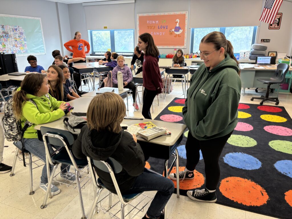 high school students in elementary school classroom