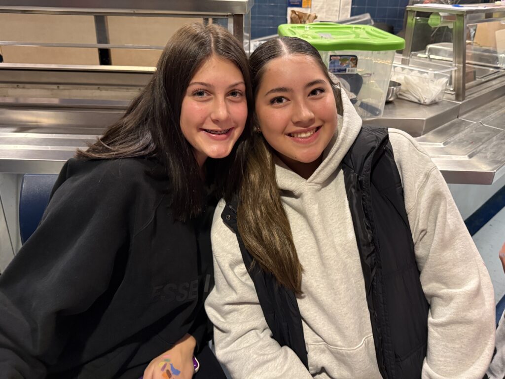 two girls smiling
