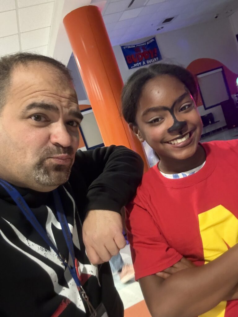 man and girl posing for photo