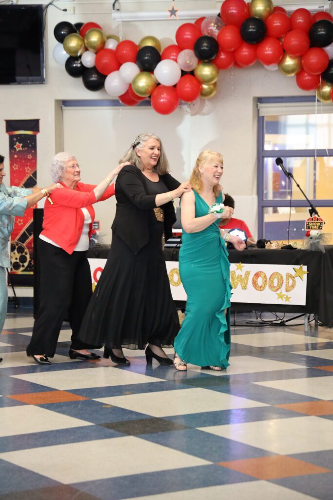 women in conga line