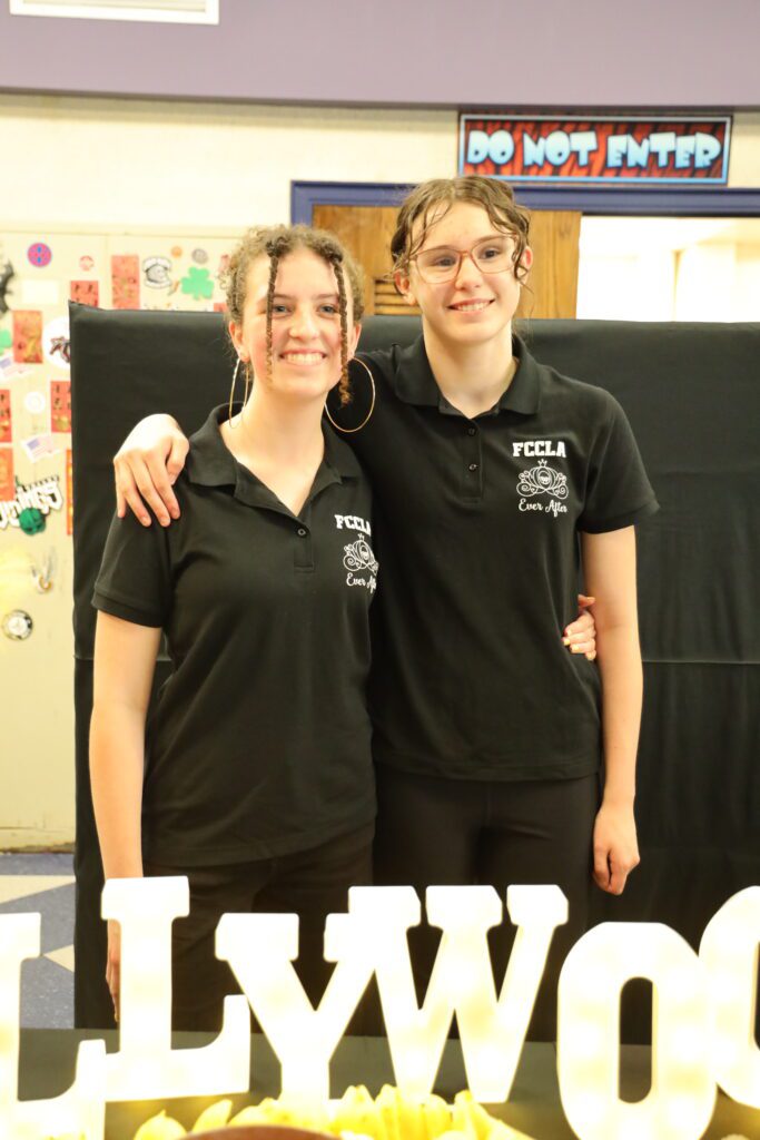 two girl in FCCLA shirts pose for photo