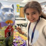 girl painting cat