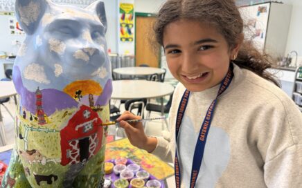 girl painting cat