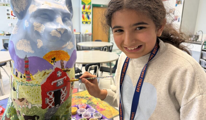 girl painting cat