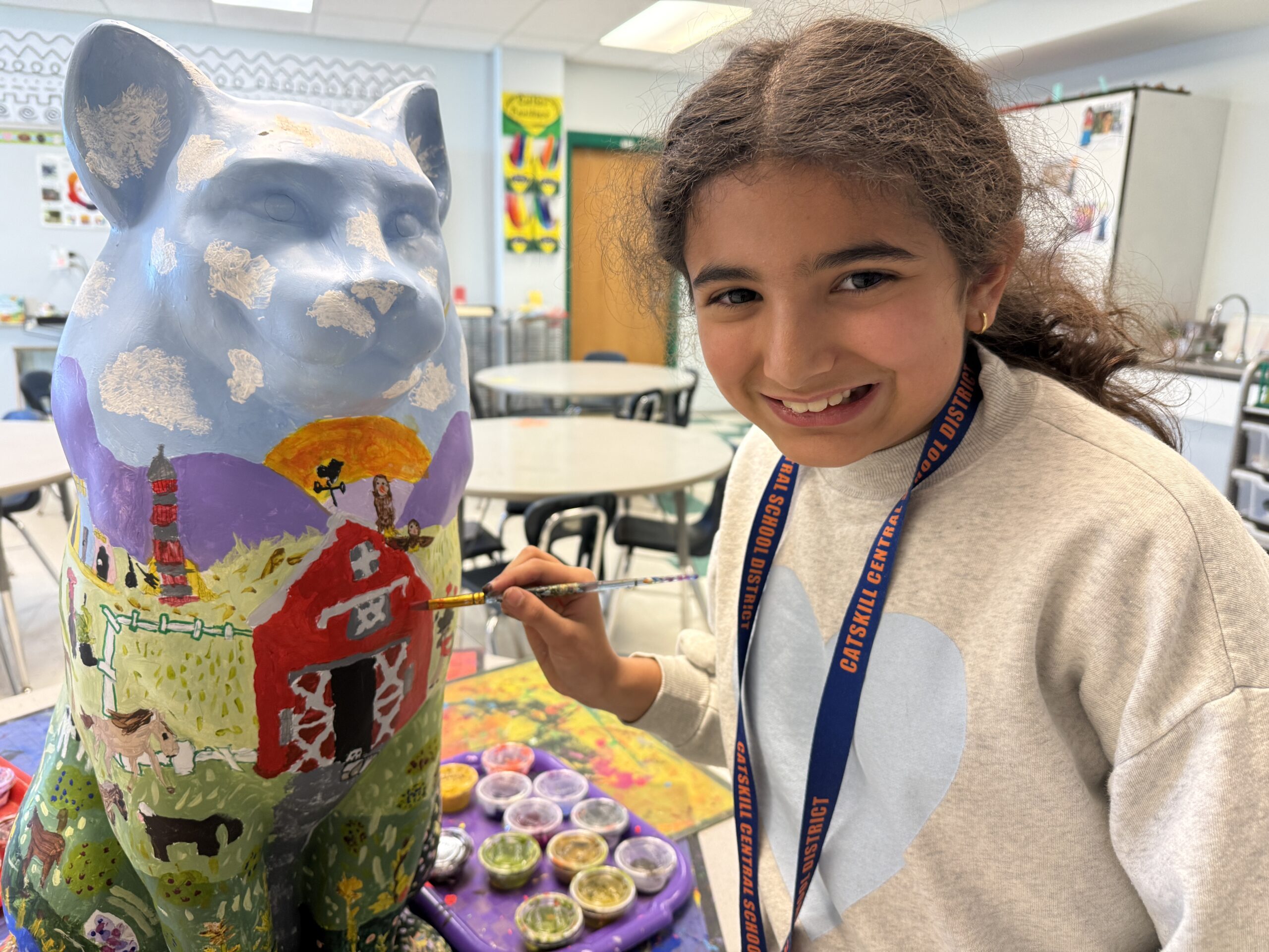 girl painting cat