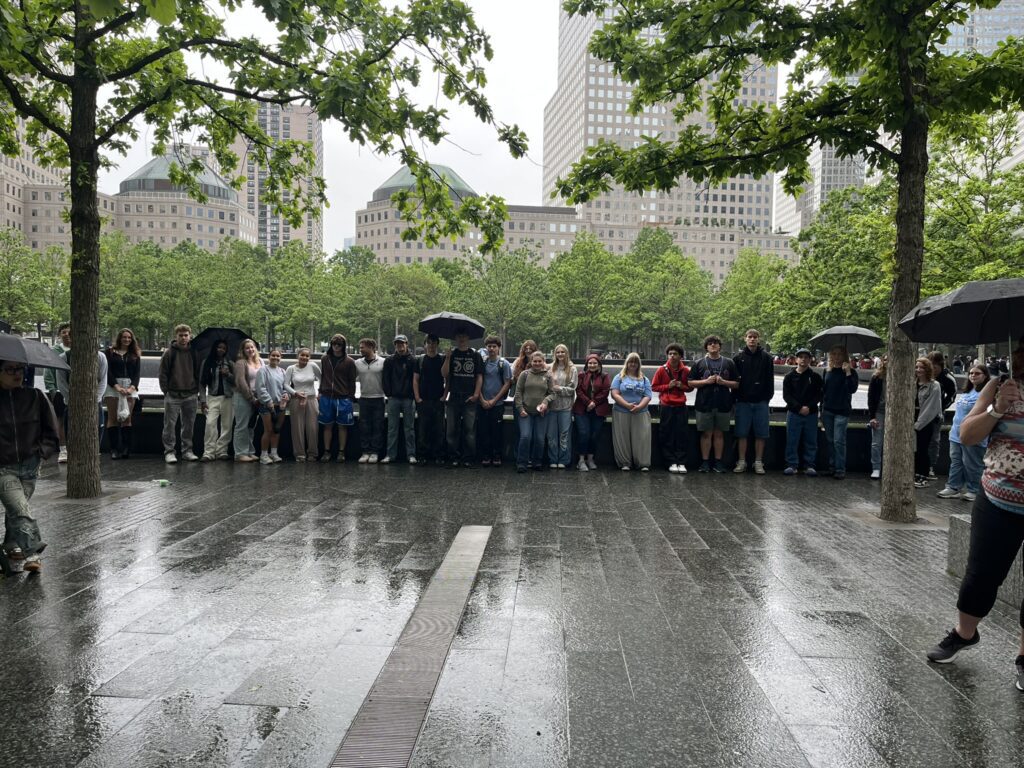 Students-Mrs.-Field-and-Mrs.-Casalino-Braving-the-Rain-at-one-of-911-Reflecting-Pools