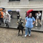 Zoey-Standing-Fearlessly-in-the-Rain-with-the-Fearless-Girl