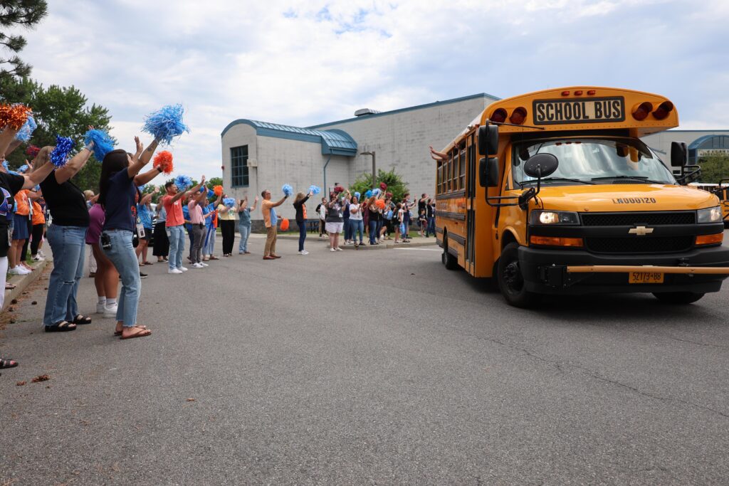 teachers waving to bus